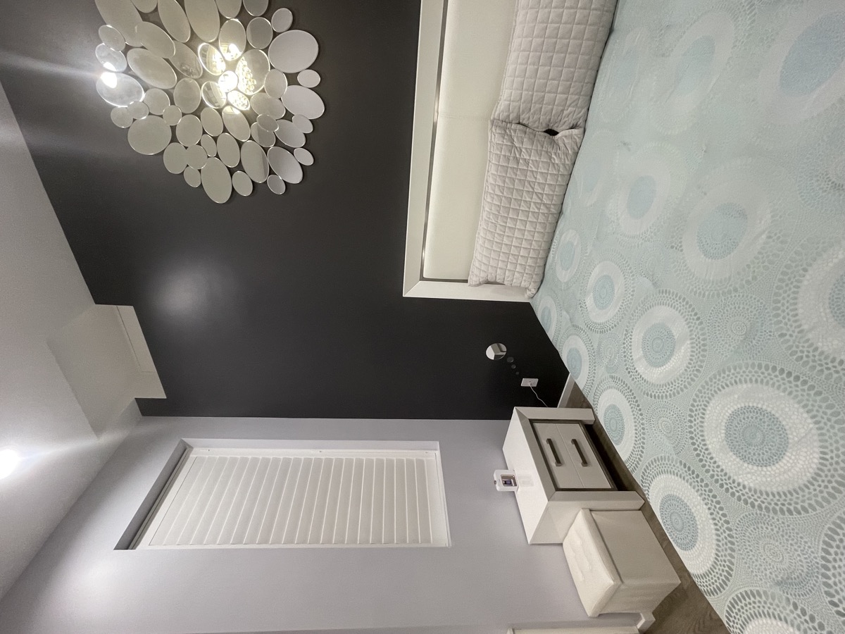 Bedroom with window and nightstand