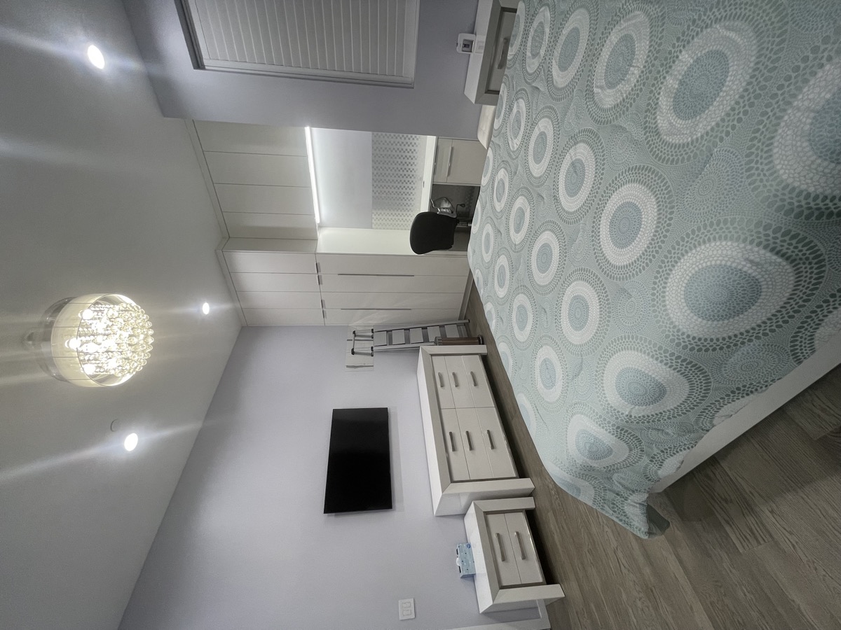 Bedroom with TV and furniture