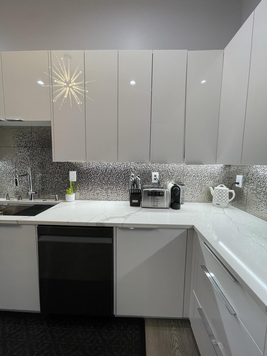 Kitchen with white cabinets and modern appliances