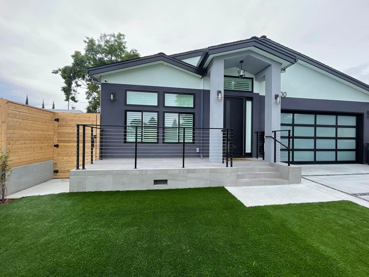 Front yard with artificial turf and patio