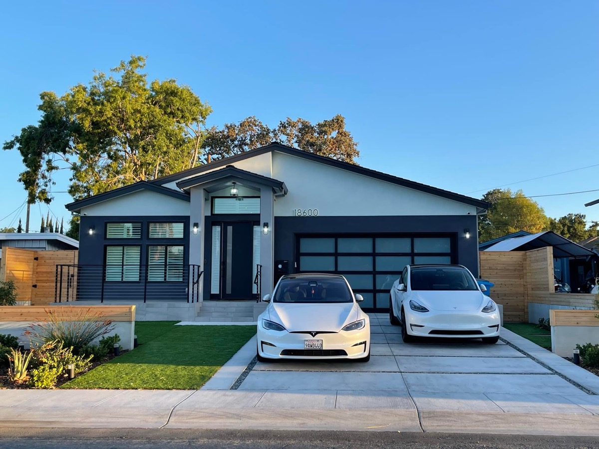 Full front view with two Tesla vehicles